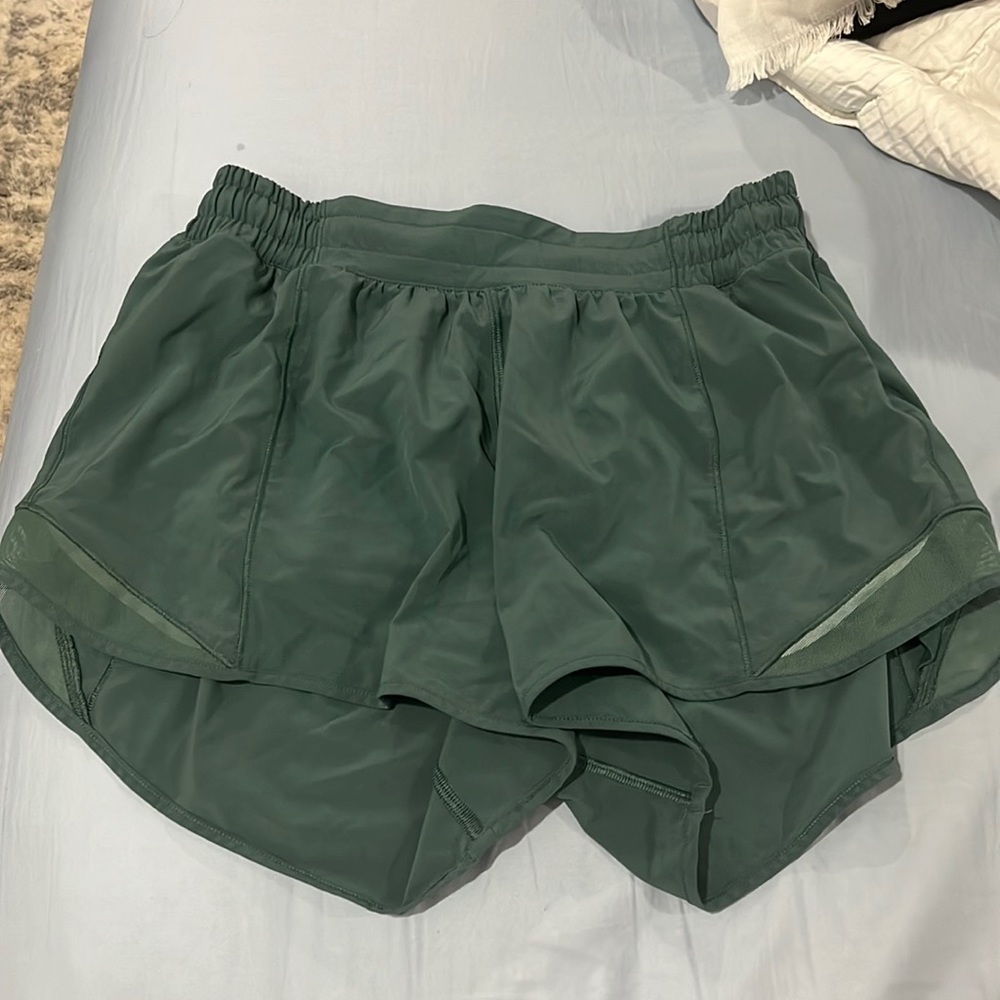Forest green hotty hot lululemon shorts. Worn a few times, no issues.